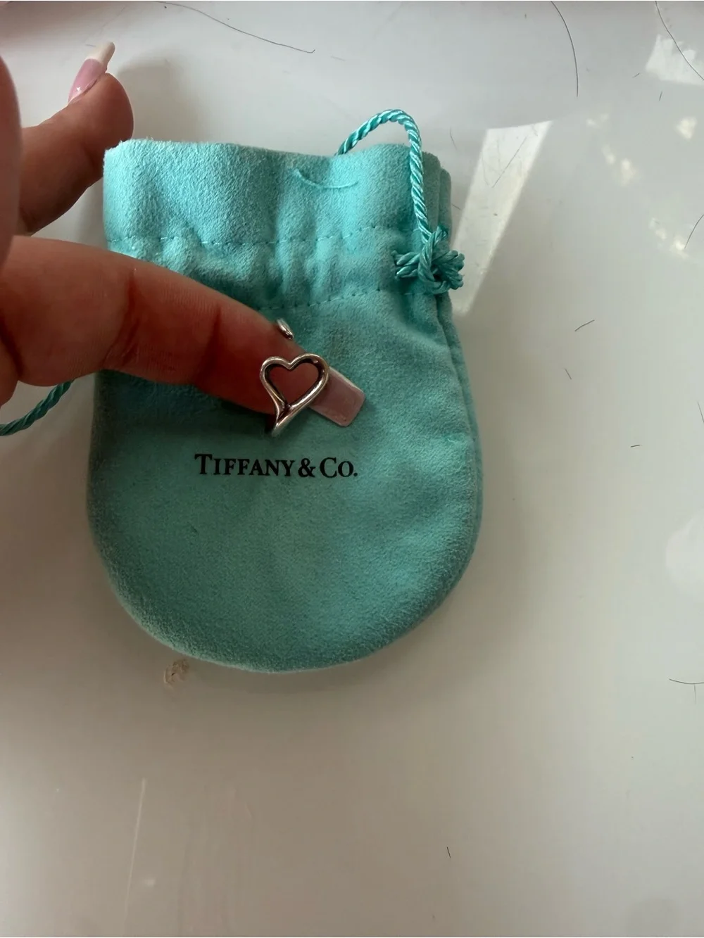Tiffany heart charm on pouch